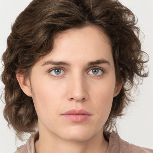 Neutral white young-adult female with medium  brown hair and green eyes