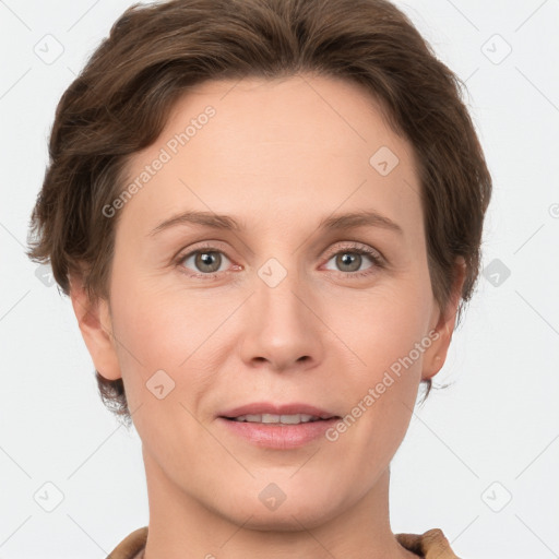 Joyful white adult female with short  brown hair and grey eyes