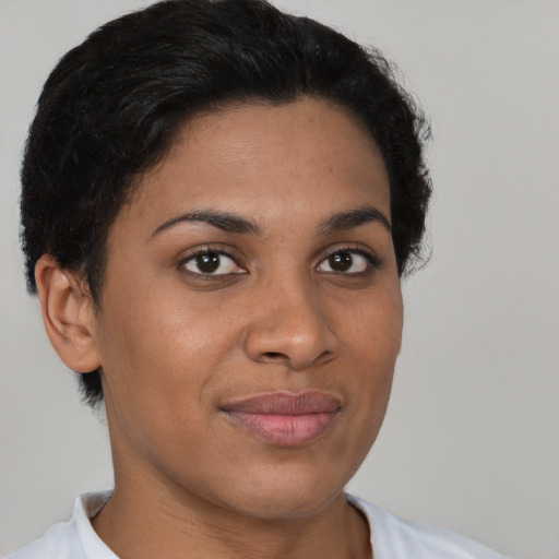 Joyful latino young-adult female with short  brown hair and brown eyes
