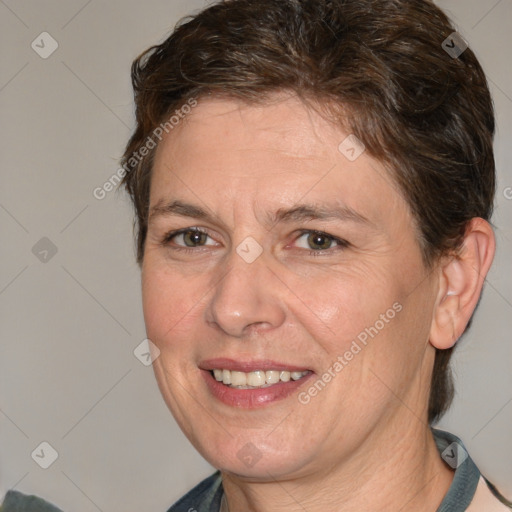 Joyful white adult female with medium  brown hair and brown eyes