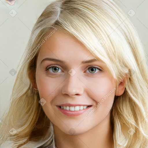 Joyful white young-adult female with long  brown hair and blue eyes