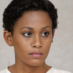 Neutral black young-adult female with short  brown hair and brown eyes