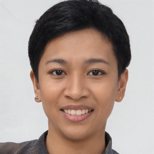 Joyful asian young-adult female with short  black hair and brown eyes