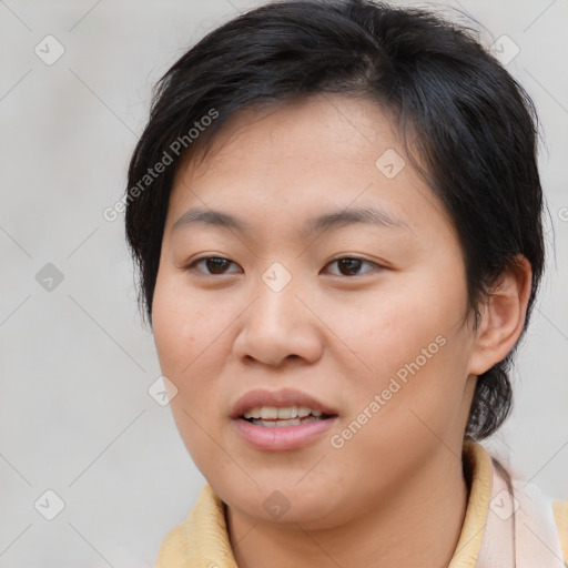 Joyful asian young-adult female with short  brown hair and brown eyes