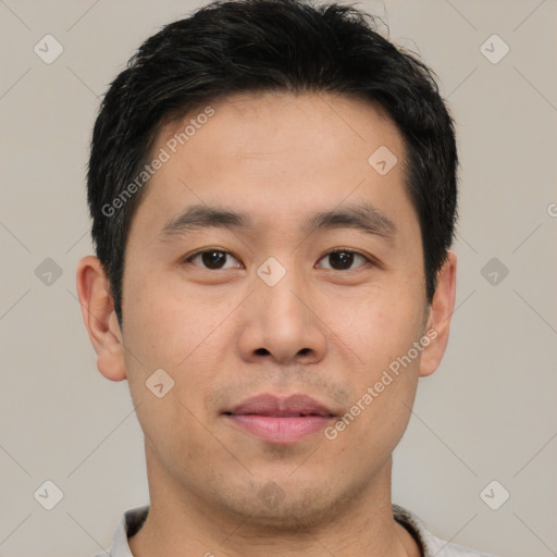 Joyful white young-adult male with short  black hair and brown eyes