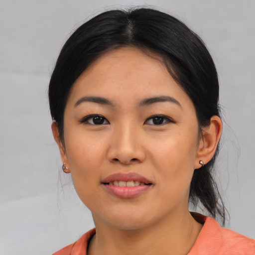 Joyful asian young-adult female with medium  black hair and brown eyes