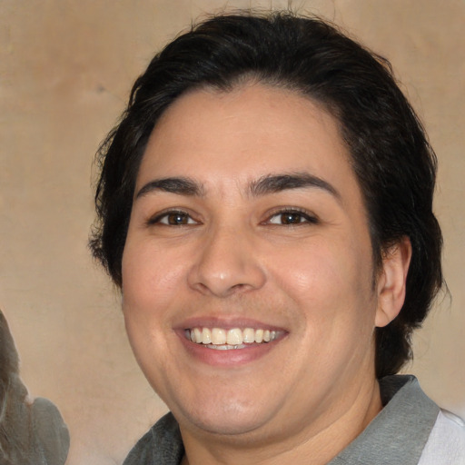 Joyful white young-adult male with medium  brown hair and brown eyes