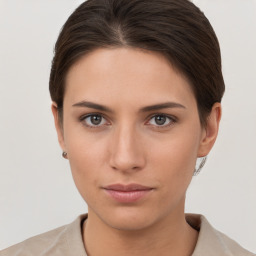 Neutral white young-adult female with short  brown hair and brown eyes