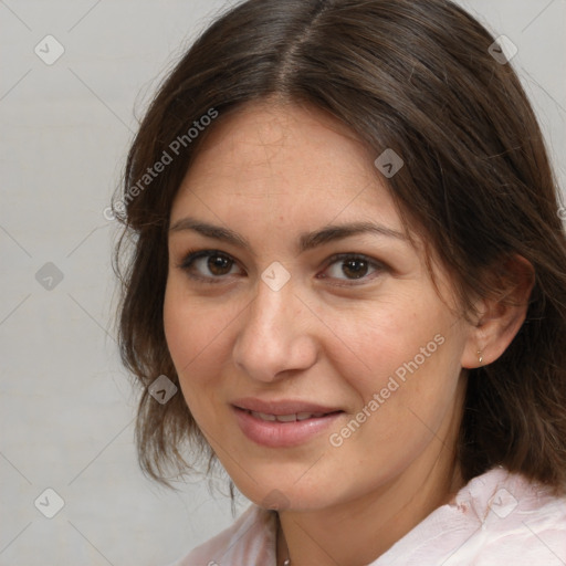 Joyful white adult female with medium  brown hair and brown eyes