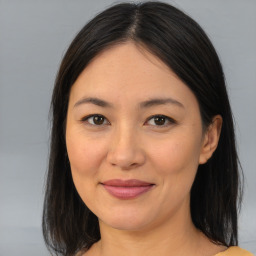 Joyful asian young-adult female with medium  brown hair and brown eyes