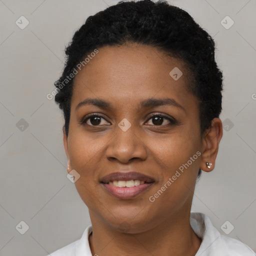Joyful black young-adult female with short  black hair and brown eyes