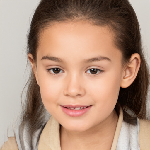 Joyful white child female with medium  brown hair and brown eyes