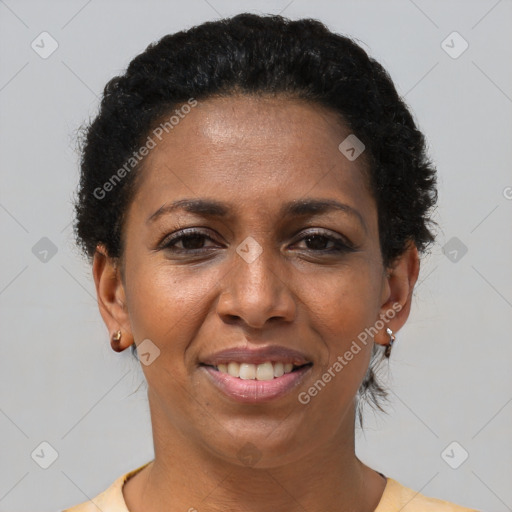 Joyful black adult female with short  brown hair and brown eyes