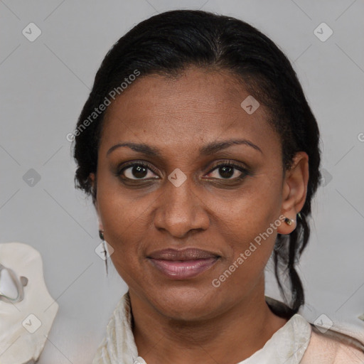 Joyful black adult female with short  brown hair and brown eyes