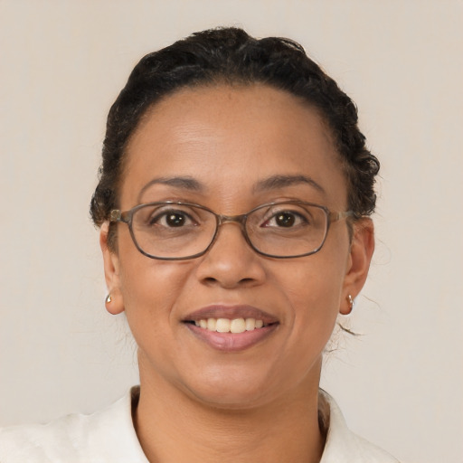 Joyful latino adult female with short  brown hair and brown eyes