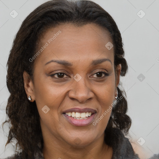 Joyful black adult female with medium  brown hair and brown eyes