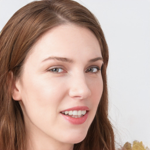 Joyful white young-adult female with long  brown hair and blue eyes