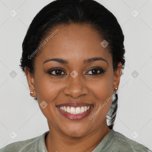 Joyful black young-adult female with short  black hair and brown eyes