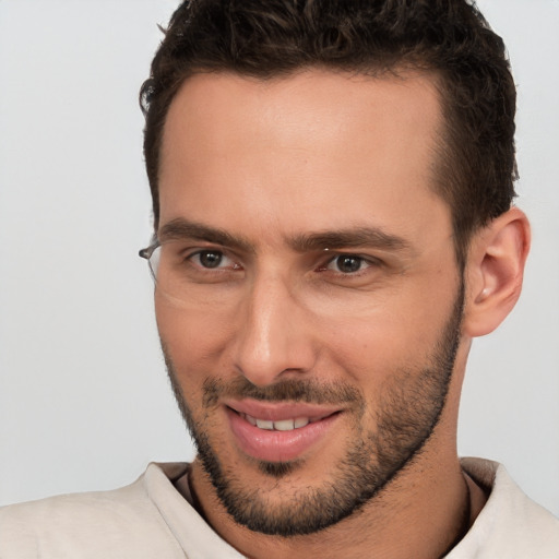 Joyful white young-adult male with short  brown hair and brown eyes