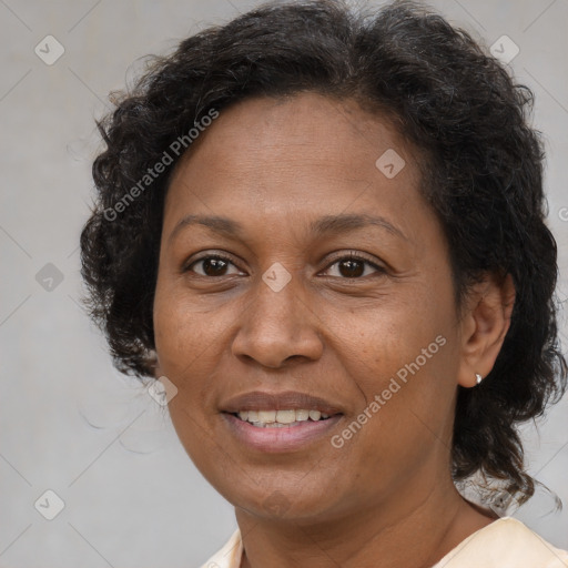 Joyful latino adult female with medium  brown hair and brown eyes