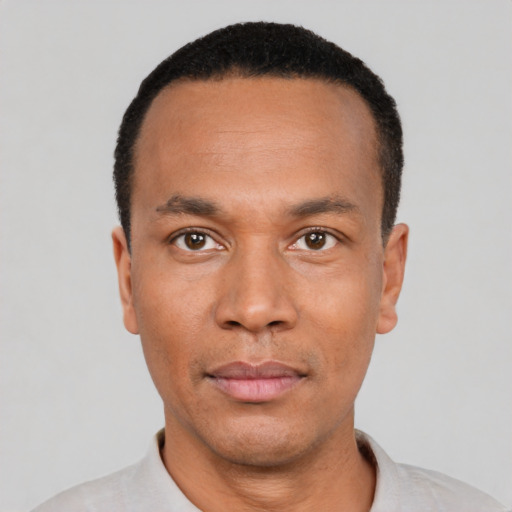 Neutral black young-adult male with short  black hair and brown eyes