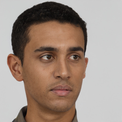 Neutral latino young-adult male with short  brown hair and brown eyes