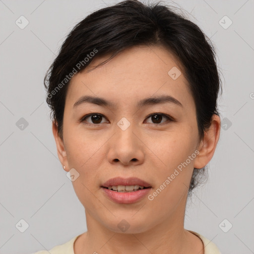 Joyful asian young-adult female with short  brown hair and brown eyes