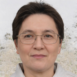 Joyful white adult female with short  brown hair and brown eyes