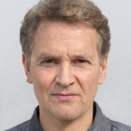 Joyful white middle-aged male with short  brown hair and brown eyes