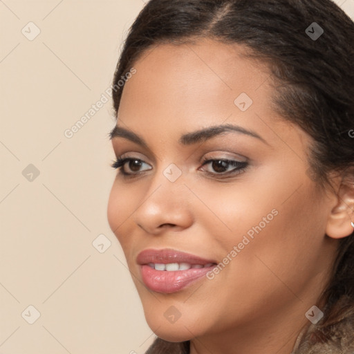 Joyful latino young-adult female with long  brown hair and brown eyes