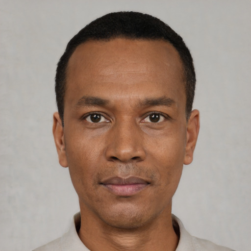 Neutral black young-adult male with short  black hair and brown eyes