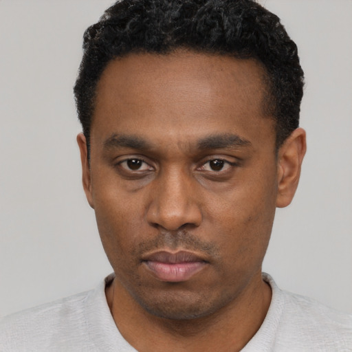 Neutral black young-adult male with short  black hair and brown eyes