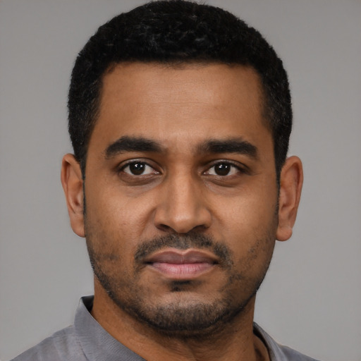 Neutral black young-adult male with short  black hair and brown eyes