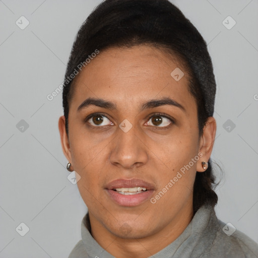 Joyful latino adult female with short  black hair and brown eyes