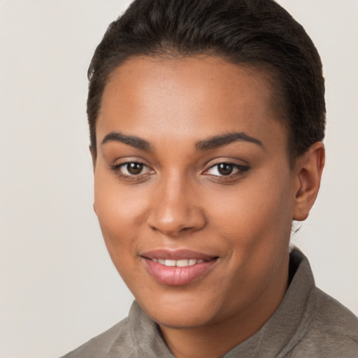 Joyful latino young-adult female with short  brown hair and brown eyes