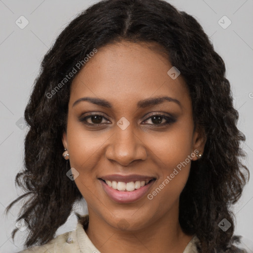 Joyful black young-adult female with long  brown hair and brown eyes