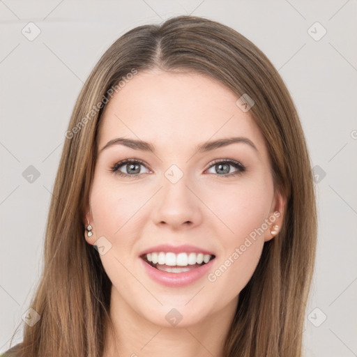 Joyful white young-adult female with long  brown hair and green eyes