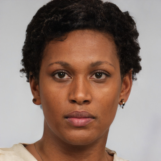 Neutral black young-adult female with short  brown hair and brown eyes