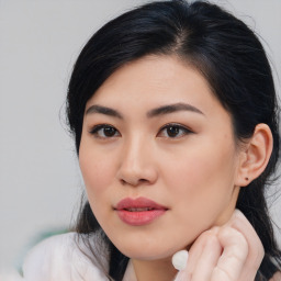 Joyful asian young-adult female with medium  black hair and brown eyes
