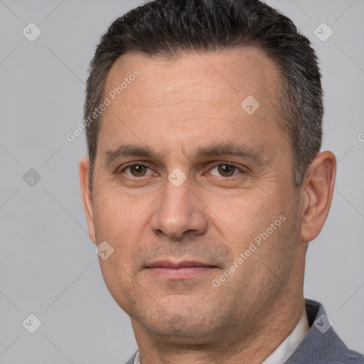 Joyful white adult male with short  brown hair and brown eyes