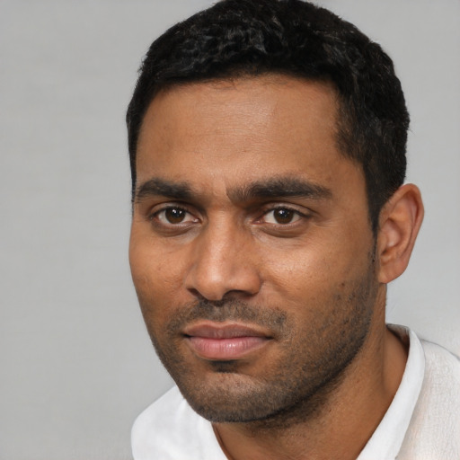 Neutral black young-adult male with short  black hair and brown eyes