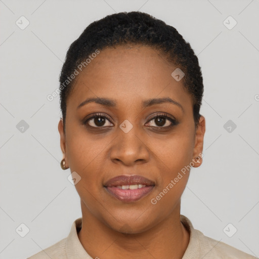 Joyful black young-adult female with short  black hair and brown eyes