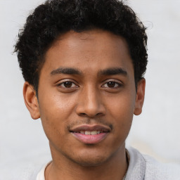 Joyful latino young-adult male with short  brown hair and brown eyes