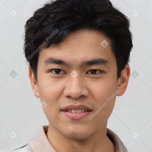 Joyful asian young-adult male with short  black hair and brown eyes