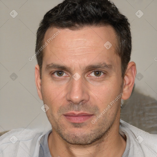 Joyful white adult male with short  brown hair and brown eyes