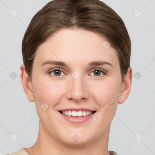 Joyful white young-adult female with short  brown hair and grey eyes