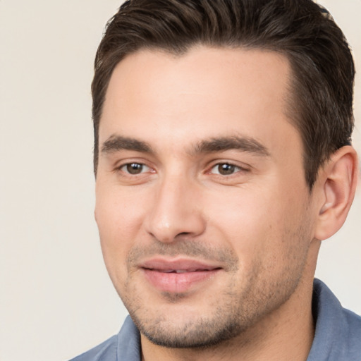 Joyful white young-adult male with short  brown hair and brown eyes