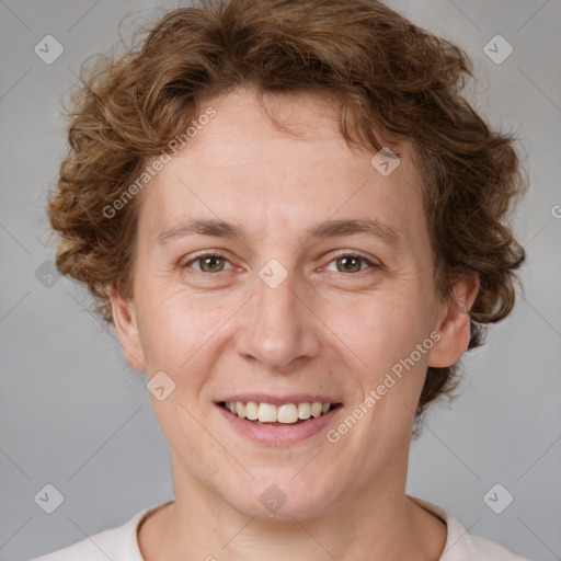 Joyful white adult female with short  brown hair and brown eyes