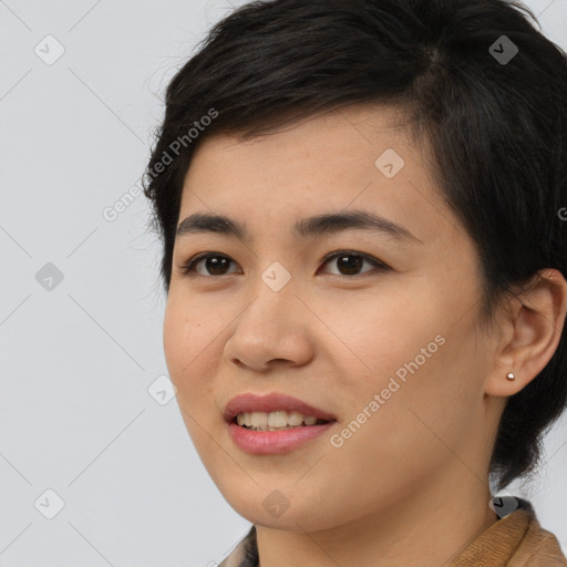 Joyful asian young-adult female with short  black hair and brown eyes