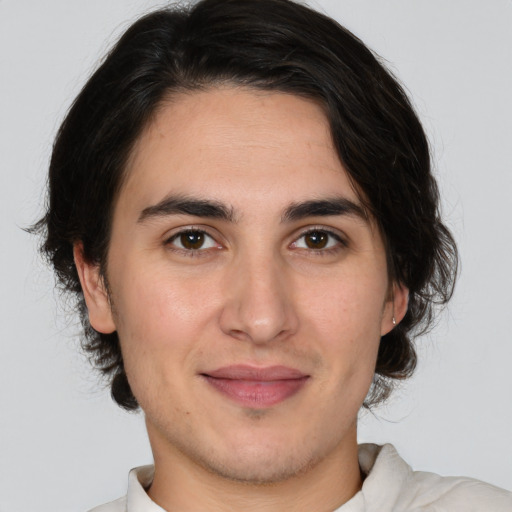 Joyful white young-adult male with medium  brown hair and brown eyes